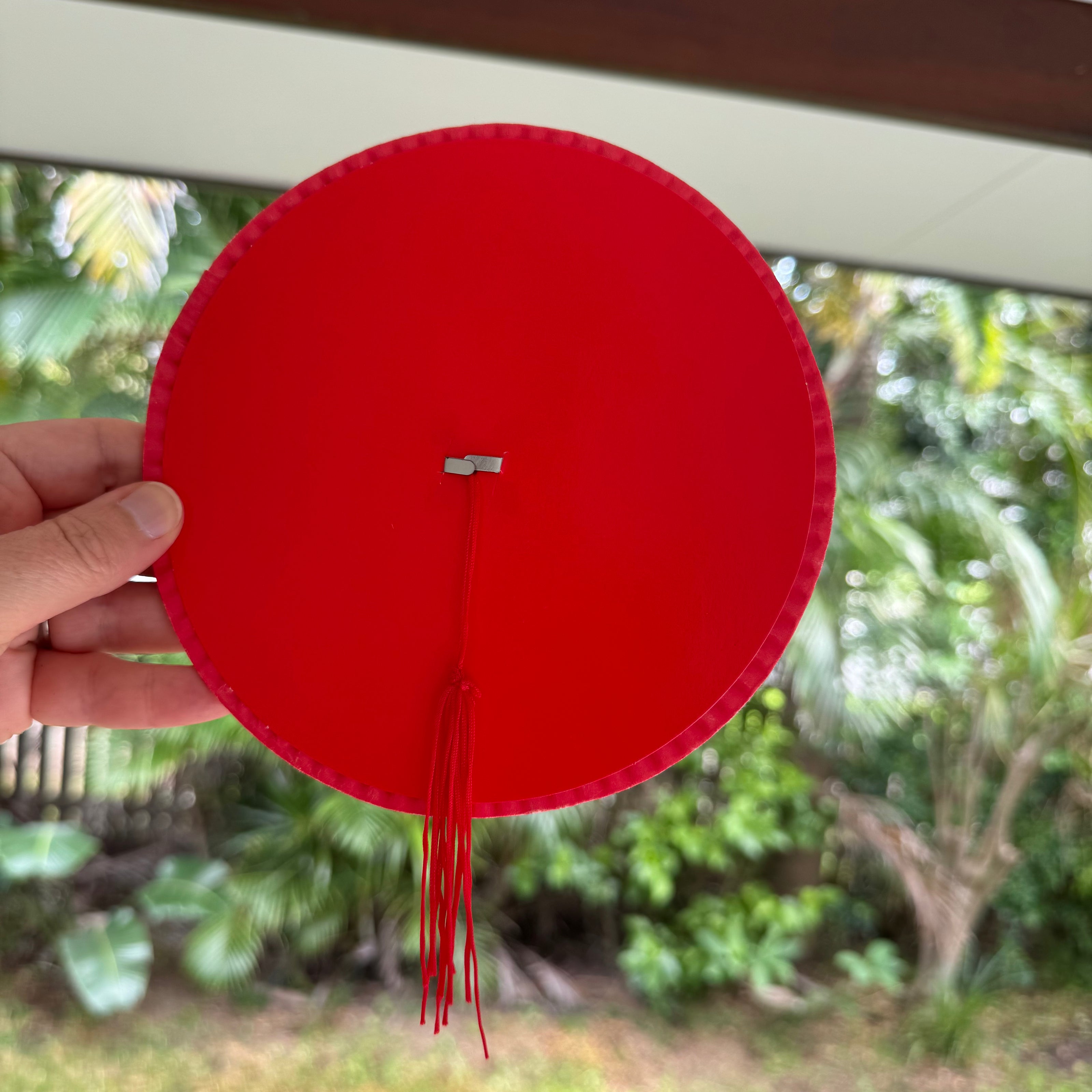 Traditional red paper lantern with tassel tail decoration