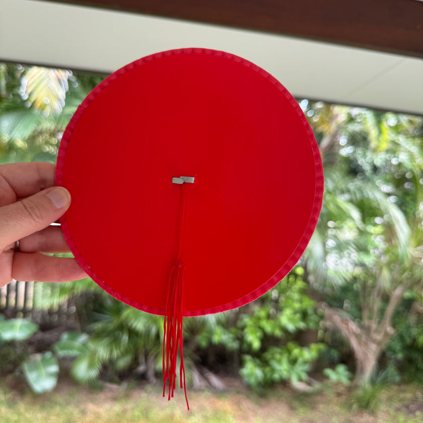 Traditional red paper lantern with tassel tail decoration