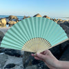 light green paper fan