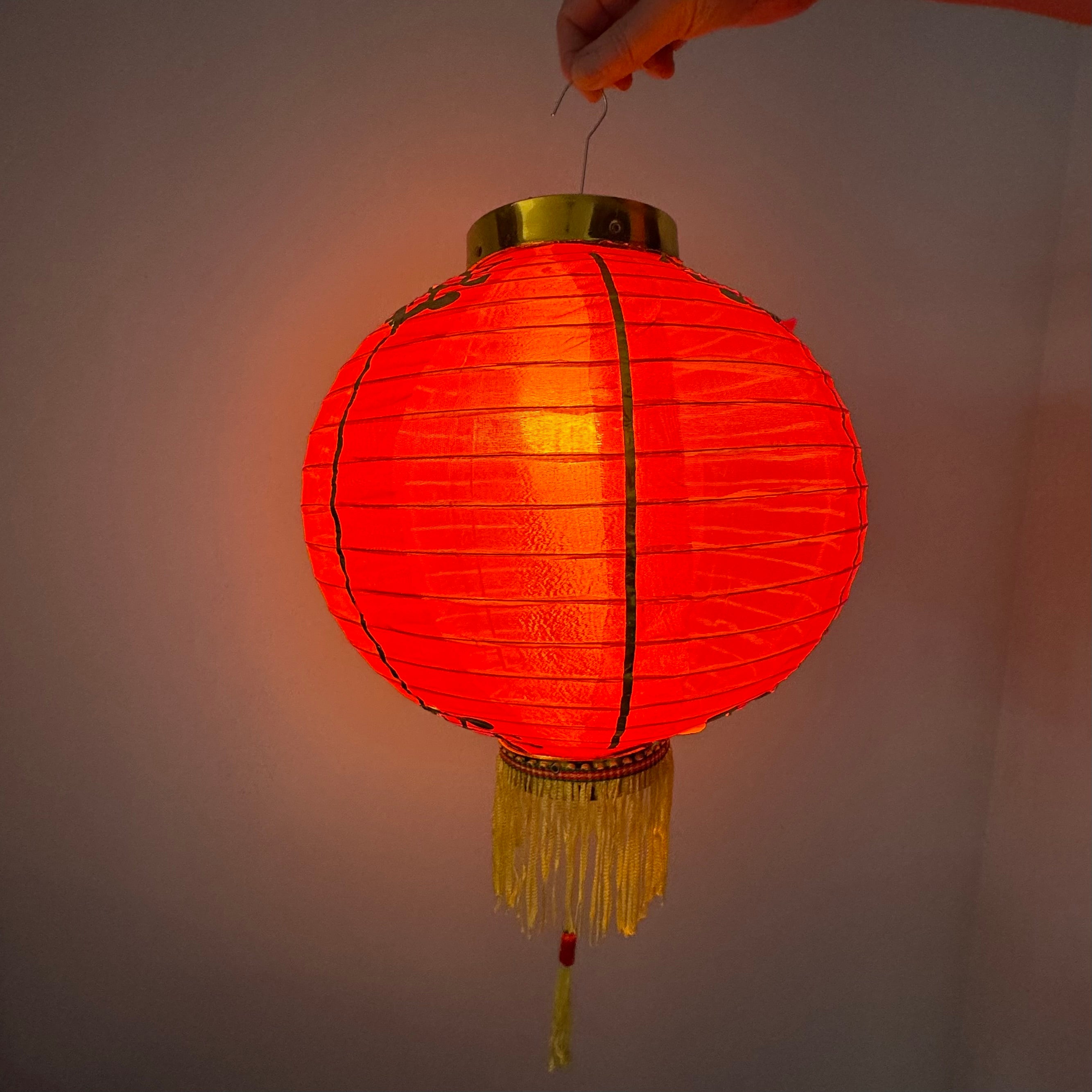 illuminated Red Chinese lantern with golden decoration Chinese New Year