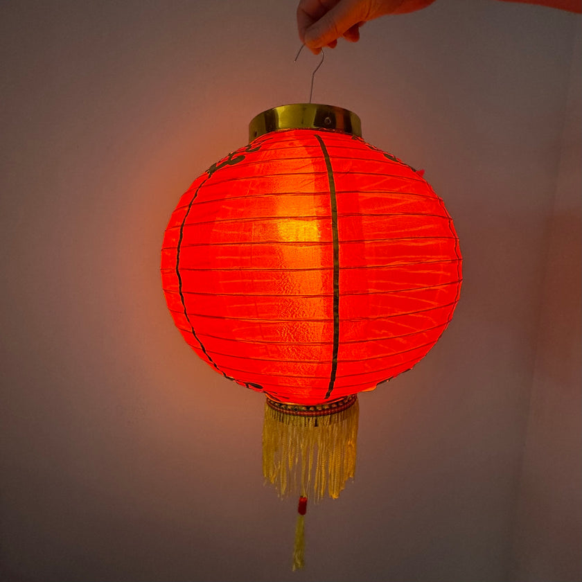 illuminated Red Chinese lantern with golden decoration Chinese New Year