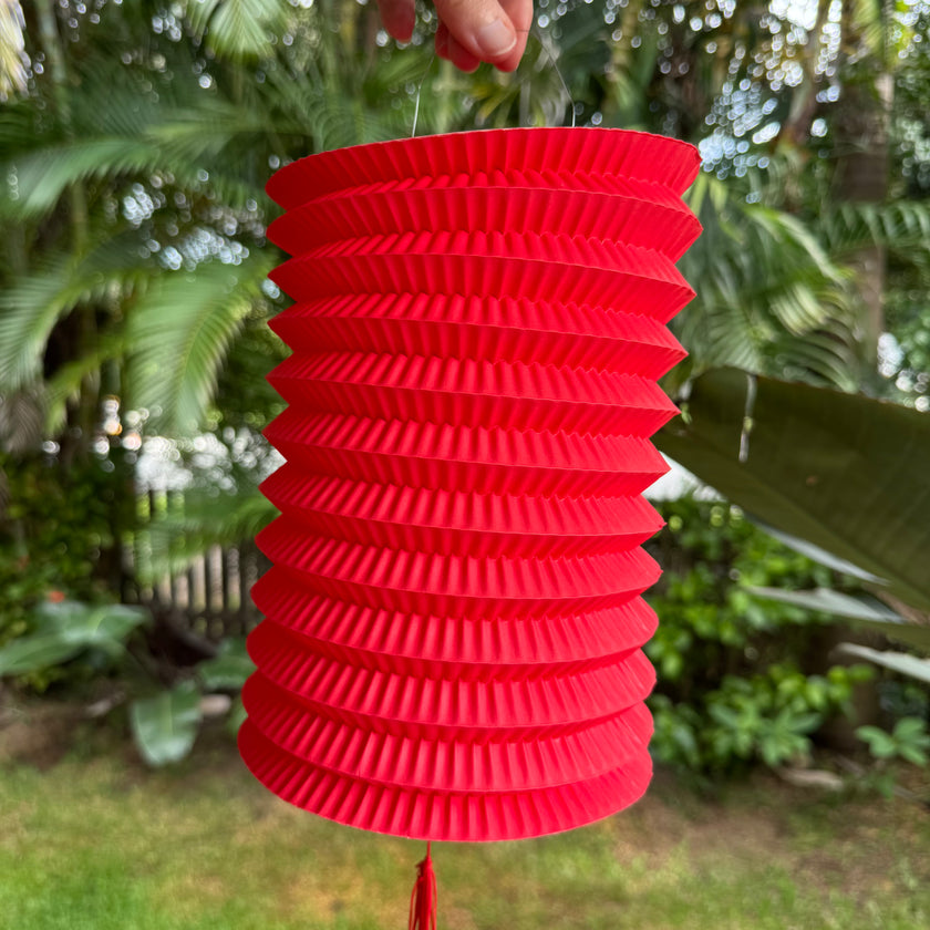traditional red Chinese paper lantern with tassel decoration