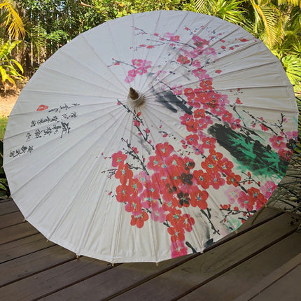 cherry blossom paper parasol with Chinese characters on timber deck