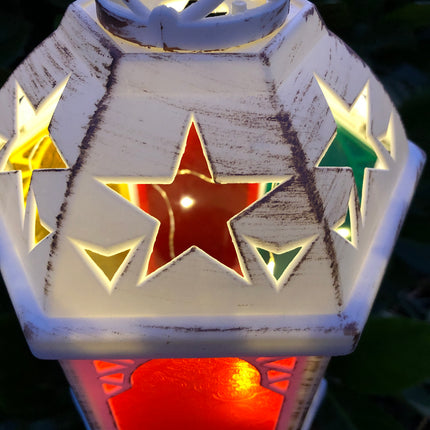 battery operated LED Moroccan lantern with fairy light string lighting illuminated