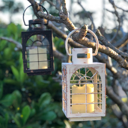 hanging candle lanterns in trees