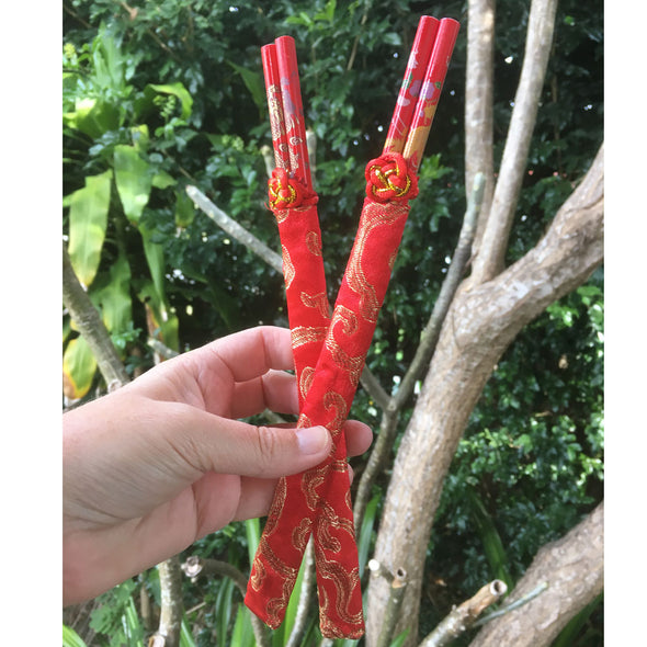dragon and phoenix chopsticks in red silk bag